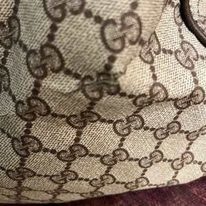 Vintage Gucci carry bag with straps. Small cuts.